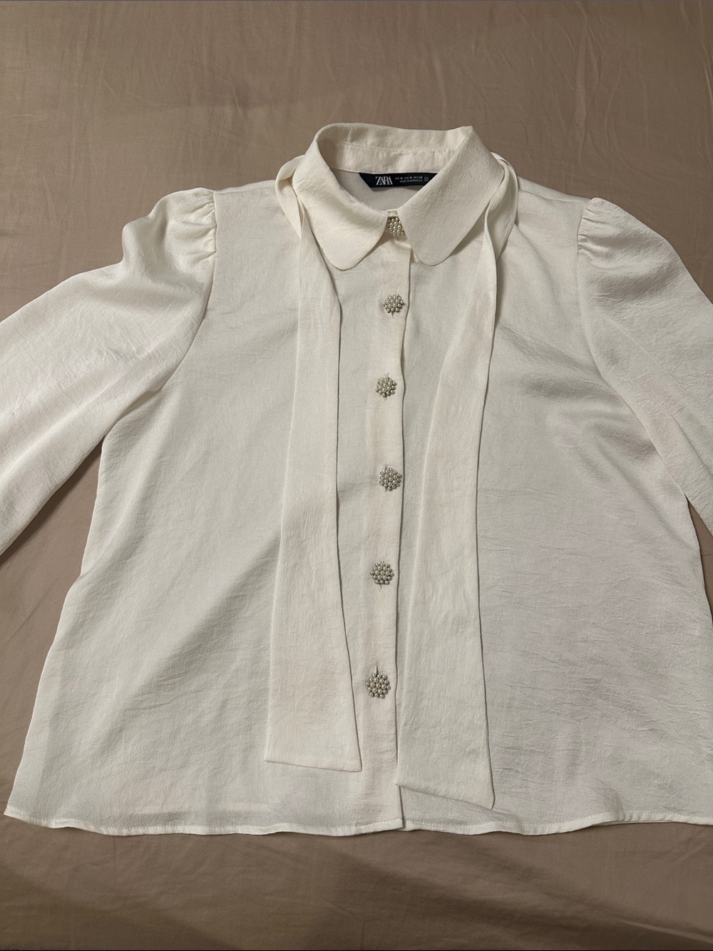 Brand new Zara Ivory Tie-Neck Blouse with Jewel Buttons